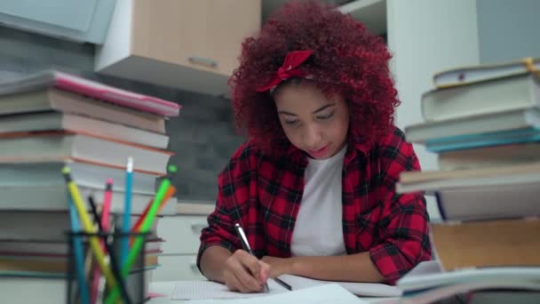 Creative student writing in notebook and smiling at cam, college education - Footage, Video