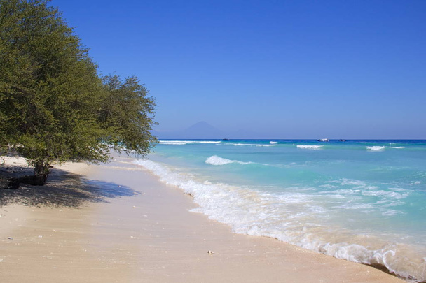 Landscape photo depicting the exotic white coral sandy beach on the northern part of Gili Trawangan in Indonesia - Fotó, kép