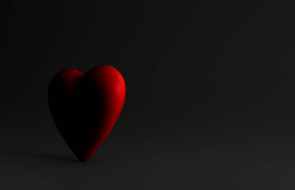 Gran Dimly Lit corazón rojo sobre fondo negro
 - Foto, Imagen