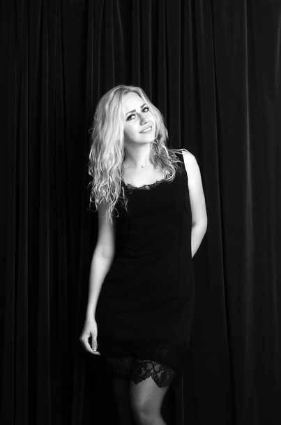 Fashion photo of young lady in elegant black dress - Photo, image