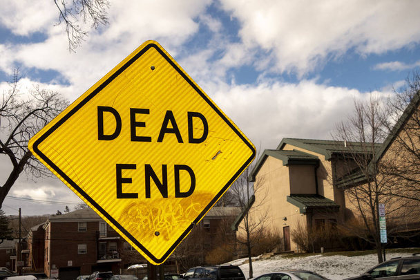 yellow abd black diamond sign reading Dead End on a sunny suburb - Photo, Image