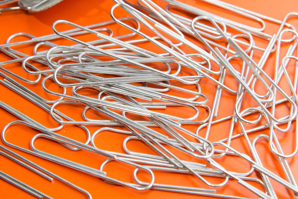 paper clips to orange background - Photo, Image