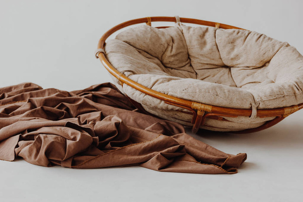 Round wicker wood chair with comfort pillow - Foto, Imagen