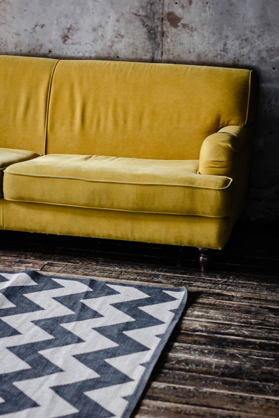Yellow velvet couch in loft room - Φωτογραφία, εικόνα