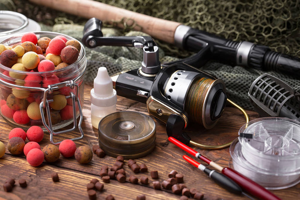 fishing tackle on a wooden table. - Photo, Image
