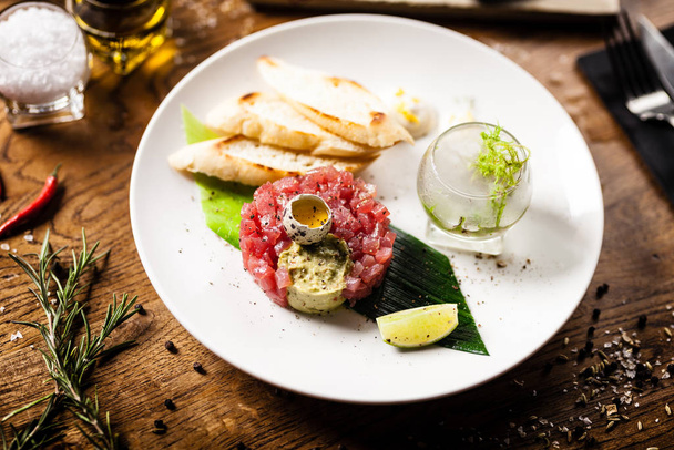 Tuna tartare served on a plate in restaurant - Photo, Image