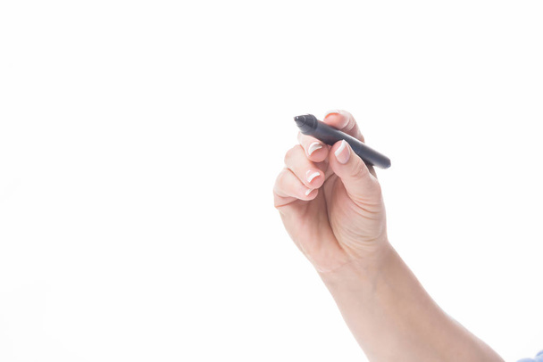 female hand holding a black pen for writing something - Foto, afbeelding