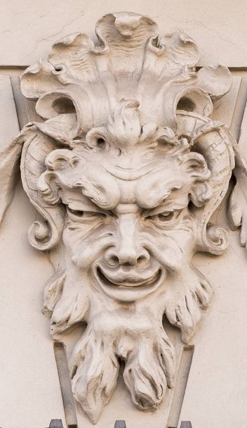 Diabolical mask on the exterior facade of a house in Augsburg (Germany) - Фото, зображення