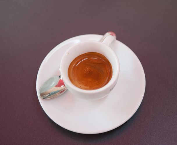 epresso in a white cup with spoon - Fotó, kép