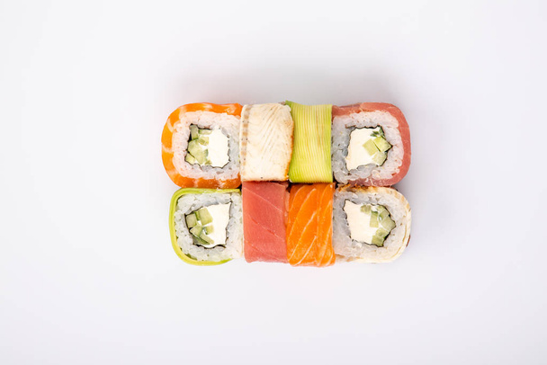 rainbow rolls top view on a white background for the menu - Photo, Image