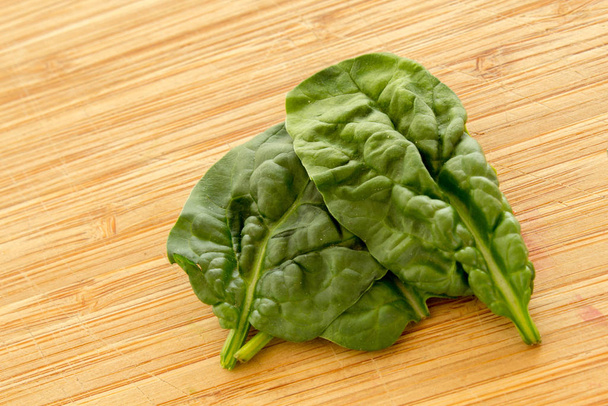 spinach on wooden board - Photo, image