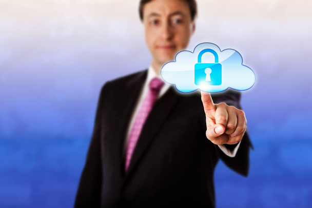 Gently smiling businessman is reaching forward to touch a locked cloud icon floating in mid-air. Technology metaphor for cloud computing, cyber security, information privacy and authentication. - Photo, image