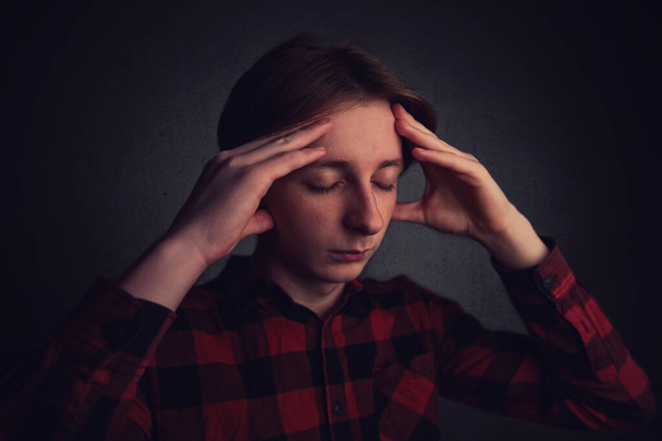 Headache feeling , emotional stress. Distressed teenager boy mes - Fotoğraf, Görsel