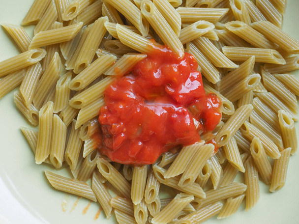 Penne pasta with tomato sauce - Фото, зображення