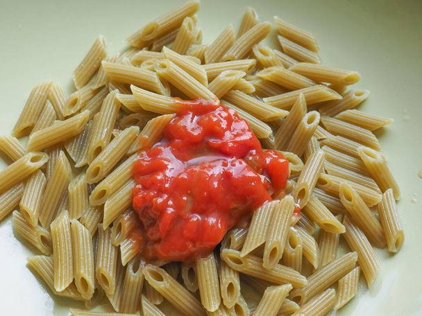 Penne pasta with tomato sauce - Fotoğraf, Görsel