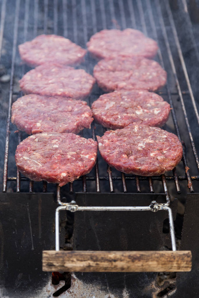 hot grill burger cutlet barbeque on grating above charcoal - Photo, Image
