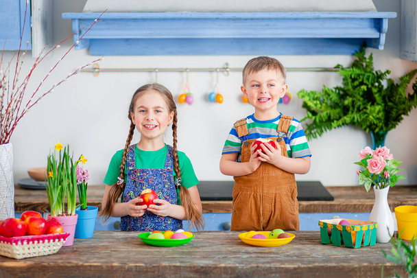 Happy easter. Cute brother and sister, funny kids boy and girl are preparing for the holiday. - Foto, Imagen