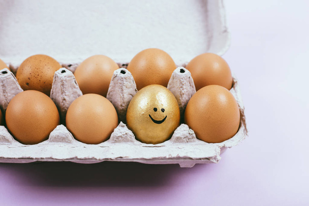 Raw chicken eggs in an open egg carton - 写真・画像