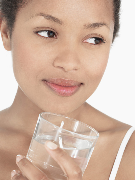 Young Woman holding glass of Water - Valokuva, kuva