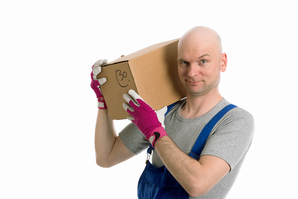 young man with bald head and cardboard in front of white background - Foto, immagini