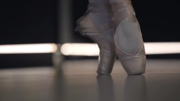 Close-up of ballerinas feet in pointes balancing on tiptoes. Professional female ballet dancer practicing. Lifestyle, art, elegance, choreography. - Séquence, vidéo
