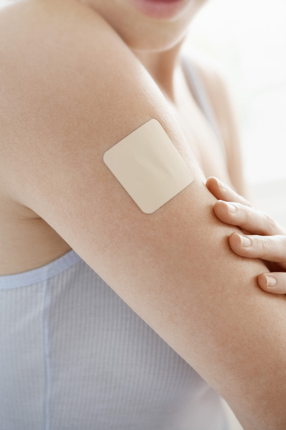 Nicotine patch on arm - Foto, afbeelding