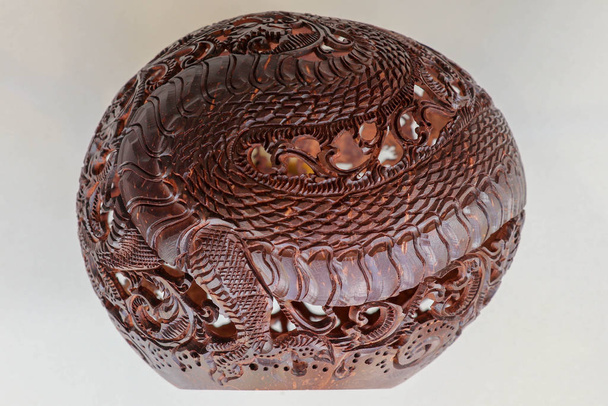 Close up ornamental shell for candle. Carved Souvenir from Cocon - Photo, Image