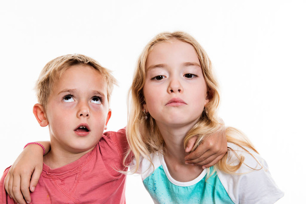two funny children in front of white background - Foto, Bild