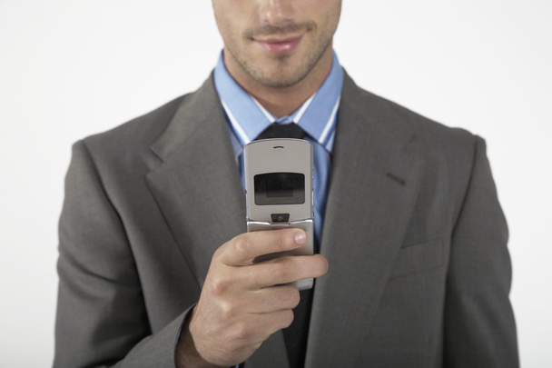 бизнесмен с помощью мобильного телефона - Фото, изображение