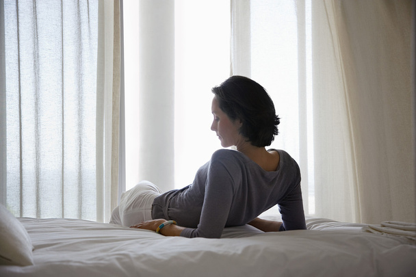 Woman Resting on Bed - Foto, Bild