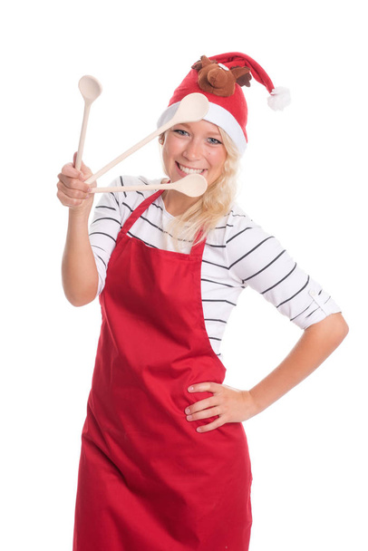 christmas woman with apron shows three cooking spoons - 写真・画像