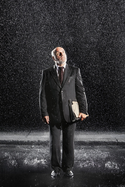 Rain falling on businessman - Foto, Imagen