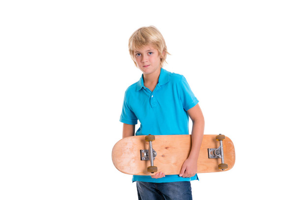 boy in blue dress with skateboard in front of white background - Valokuva, kuva