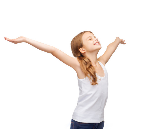 Smiling teenage girl with raised hands - Photo, Image