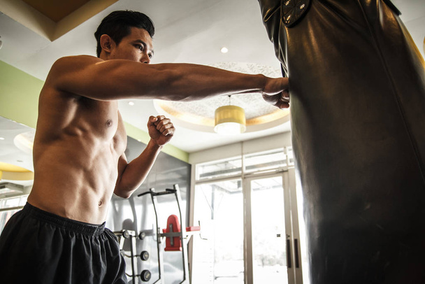 Man performs exercise - Boxing - Valokuva, kuva