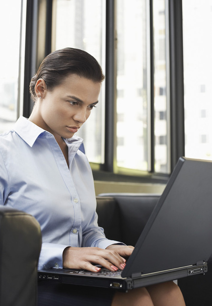 Businesswoman using laptop - Photo, image