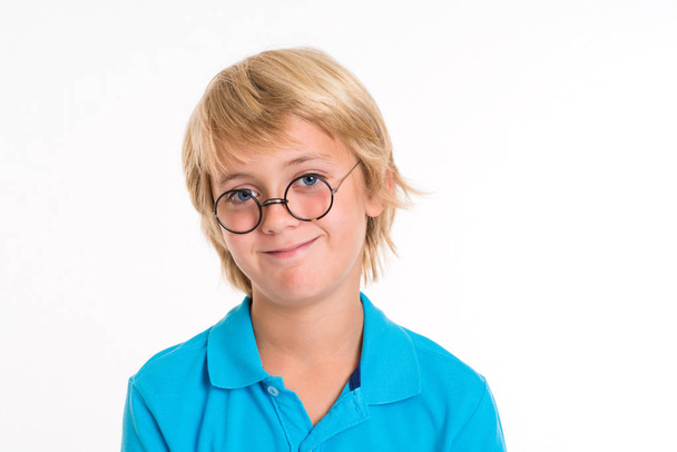 smiling blond boy with round glasses in front of white background - Fotoğraf, Görsel