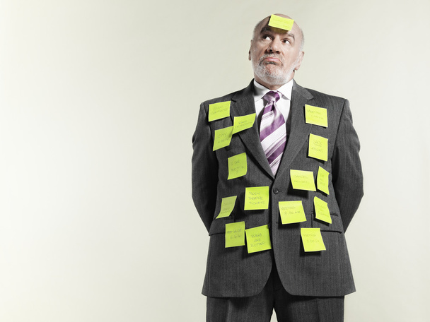 Businessman covered with sticky notes - Φωτογραφία, εικόνα