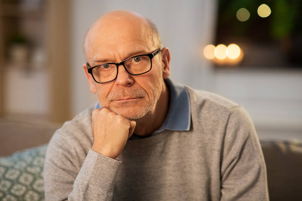 sad senior man in glasses thinking at home - Фото, зображення