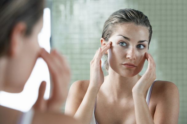 Woman Applying Facial Cream - Foto, Imagem