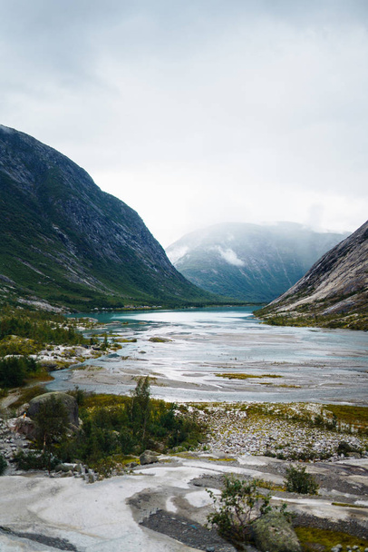 Picturesque landscape mountains of Norway. Beautiful view of the lake. Rocky shore of mountain lake in the morning. Travelling, lifestyle, wild nature concept. - Photo, image