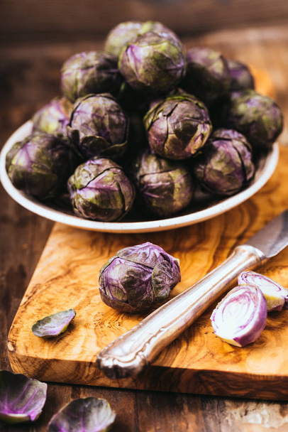 fresh purple brussels sprouts on a background - Фото, изображение