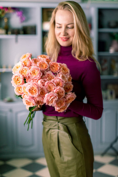 Large beautiful bouquet of mixed flowers in woman hand. Floral shop concept . Handsome fresh bouquet. Flowers delivery. - Fotó, kép