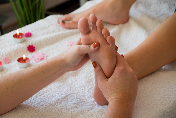 female foot being massaged - Foto, afbeelding