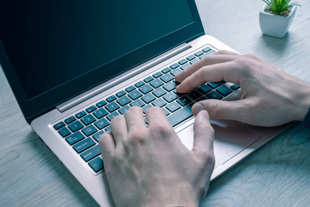 Work online with laptop computer concept. Detail of hands on laptop keyboard - Foto, Imagen
