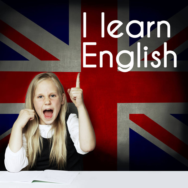 Happy smart child against the UK flag background. Learn English  - Foto, afbeelding
