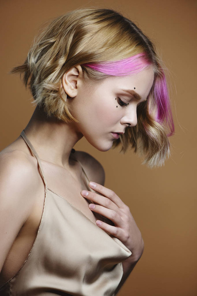 Side view of beautiful girl with pink hair. - Photo, image