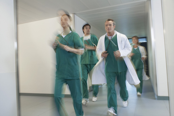 Doctors and nurses in scrubs running - Foto, Imagem