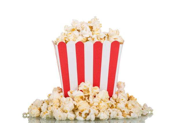 Large square box filled with mountain popcorn and around on whit - 写真・画像