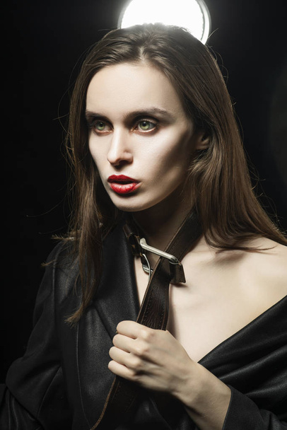 Braless girl with red lips, wearing a black unbuttoned blazer an - 写真・画像